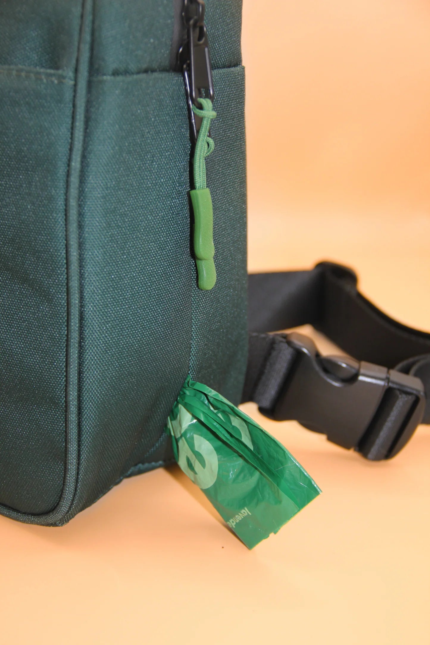 Dog walking bag with poop bag dispenser