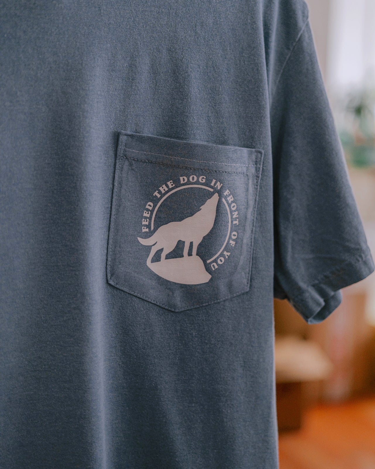 Feed The Dog In Front Of You Pocket Tee